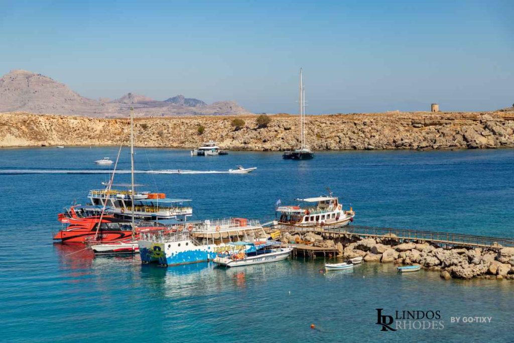 Boats anchored in the harbor area near Lindos on the coast of Rhodes.